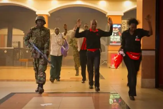 Civilians raise their arms at the Westgate mall